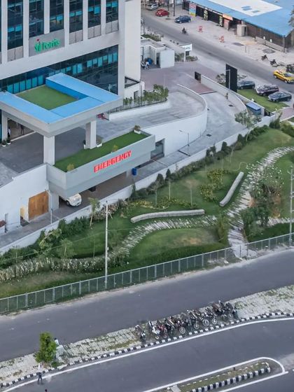 We integrate recreational and green spaces within our healthcare campuses. This aerial view of Fortis Hospital shows a landscaped area designed to provide a space for physical recovery and mental solace.