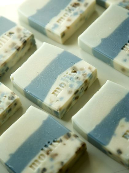 A grid of the new terrazzo-style soaps, each with a unique pattern of soap chips.
