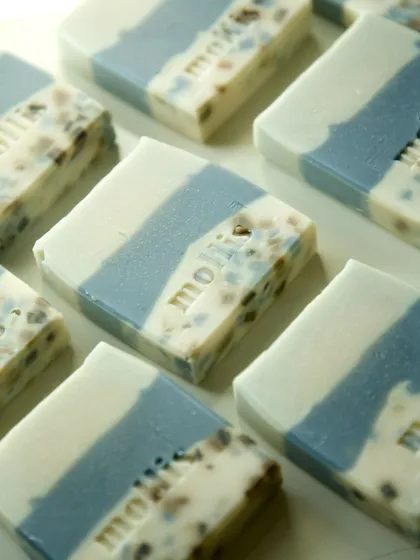 A grid of the new terrazzo-style soaps, each with a unique pattern of soap chips.