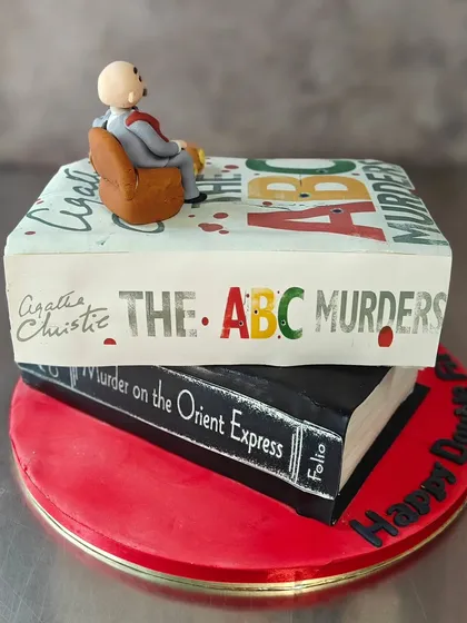 For the mystery lovers, this Agatha Christie cake was a thrilling challenge. We recreated the book covers of "The ABC Murders" and "Murder on the Orient Express" with a tiny Hercule Poirot on top. It’s proof that if you can dream it, we can bake it.