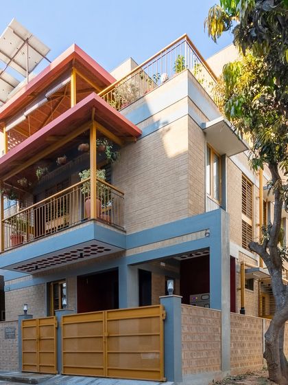 The house at dusk, with warm lights creating an inviting glow.