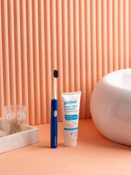 We create custom sets to match a product's aesthetic. This bathroom scene for an oral care brand uses a fluted peach backdrop and marble props to create a warm, modern feel.