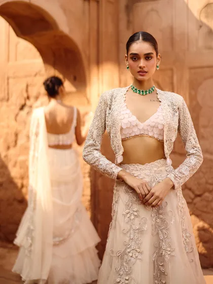 This look from the Awigna shoot features a delicate bralette with a stunning embroidered jacket. A chic and modern way to do bridal layering.