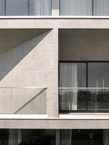 The balconies of Villa Vue are designed as tapered voids carved from the building's mass. This architectural strategy not only creates a dynamic facade but also ensures that each private space has a directed and unobstructed view of the Bay of Bengal.