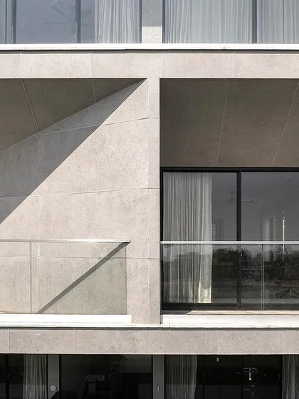 The balconies of Villa Vue are designed as tapered voids carved from the building's mass. This architectural strategy not only creates a dynamic facade but also ensures that each private space has a directed and unobstructed view of the Bay of Bengal.
