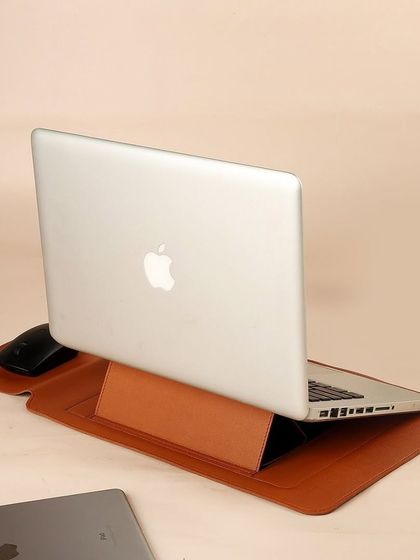My vegan leather laptop sleeve doubles as an ergonomic stand. This innovative design provides a comfortable angle for typing while protecting the device, making it a smart and stylish work-from-anywhere accessory.