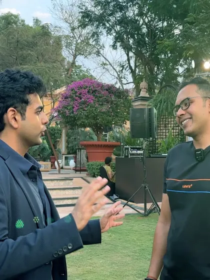 In conversation at a sophisticated event for Lamborghini Mumbai. My performance style is designed to complement the elegance and luxury of high-end brand events.