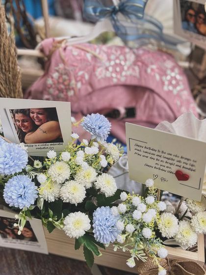 A close-up on the personalized details, including handwritten notes and photographs, that make a milestone gift truly unforgettable.