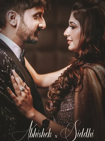 A romantic, warm-toned portrait of a couple from their engagement, personalized with their names.