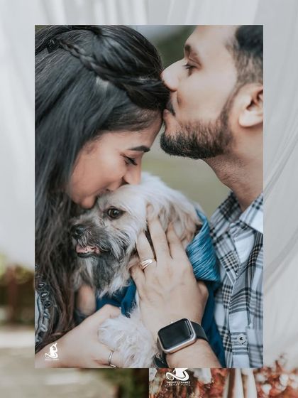 A heartwarming close-up of a couple kissing their dog's head, a perfect shot for pet-loving clients.