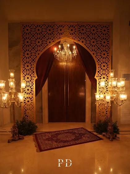 We transport your guests to another world from the moment they arrive. This grand entrance for a Sufi-themed Sangeet used intricate jaali work, rich velvets, and dramatic candelabras to set a tone of royal, mystical elegance.