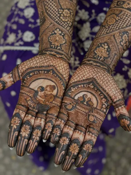 This design is one of the most special I've ever done. We included a portrait of the bride's beloved aaji (grandmother) on her palm, keeping her close during the wedding ceremonies. Mehendi is truly an emotion.