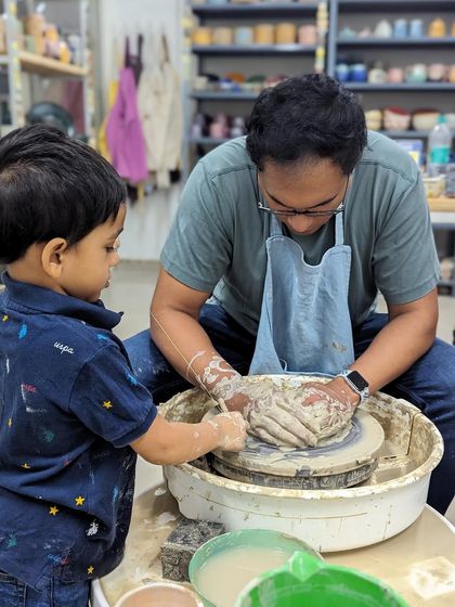 A beautiful moment of shared creation. Our studio is a family-friendly space where all ages can get their hands in the clay.
