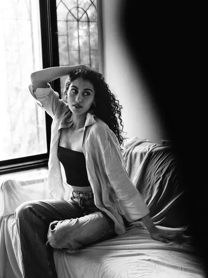 Using shadows and framing to create a mysterious and artistic black and white composition during a home shoot.