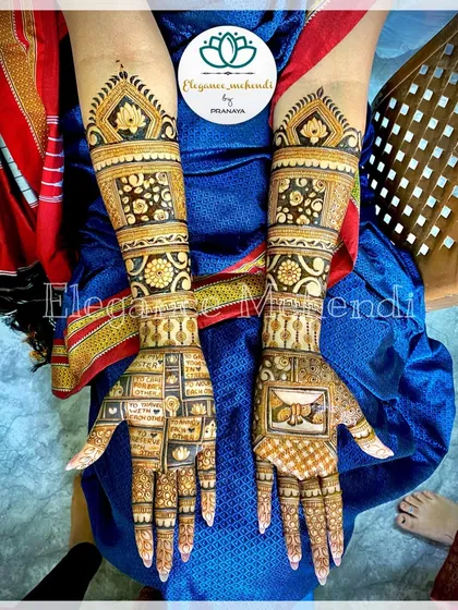 This bridal design is personalized with blocks that spell out the wedding vows. The other hand features a beautiful bride figure in a palki.