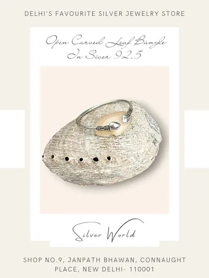 An open carved leaf bangle in pure 92.5 silver. This free-size design is delicate and inspired by nature.