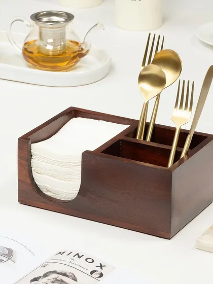 A clean, e-commerce style shot for a wooden cutlery and napkin holder. The styling is minimal to keep the focus on the product's design and functionality, showing it on a neatly set table.