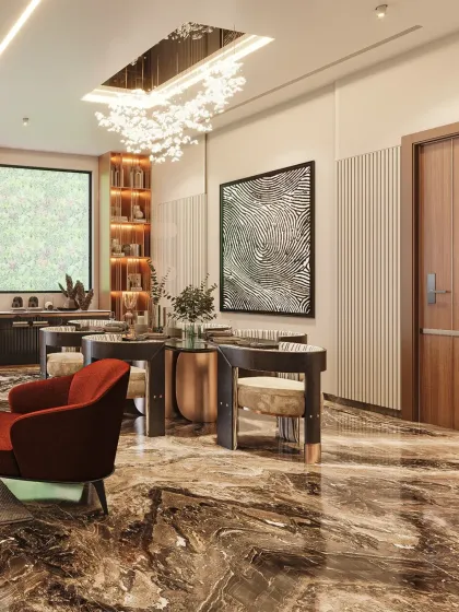 This lobby design features rich marble flooring, a sculptural staircase, and layered textures in metal and wood to create a bold yet balanced interior.