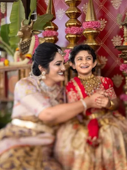 A candid moment of pure joy between a mother and her daughter during a traditional ear piercing ceremony. These are the unscripted memories I love to capture.