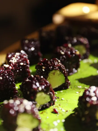 A unique creation of sticky rice with an avocado center, showcasing our innovative fusion concepts.
