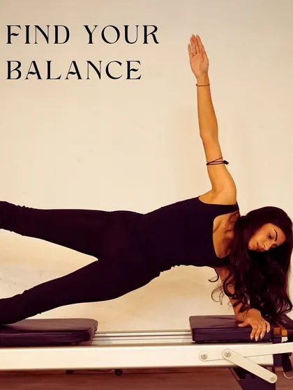 This is the goal: finding your balance. This side plank on the reformer is an amazing full-body exercise that builds core stability and control. It’s a powerful pose that shows the strength you'll build here.
