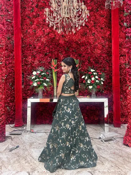 Another look at our client in the green floral lehenga. The back of the blouse and the flow of the skirt are designed to look beautiful from every angle.