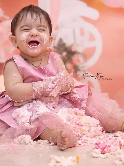 First birthdays are for making a happy mess. This cake smash session was full of laughter as she dove right into the frosting, creating a memory of pure, sweet fun.