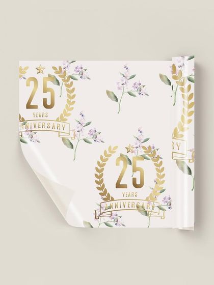 A roll of the beautiful lilac-themed gift wrap. This shows how a custom pattern can be used to create a truly bespoke and luxurious gifting experience for any special occasion.