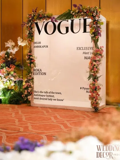 Our custom 'Vogue' magazine cover photo booth, a chic and unique element for a modern Roka or engagement. Framed with delicate pastel flowers, it allows the couple and their guests to have their own cover star moment.