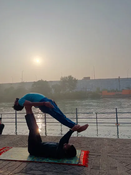 The classic front plank pose, a foundational acroyoga posture that builds core strength and stability.
