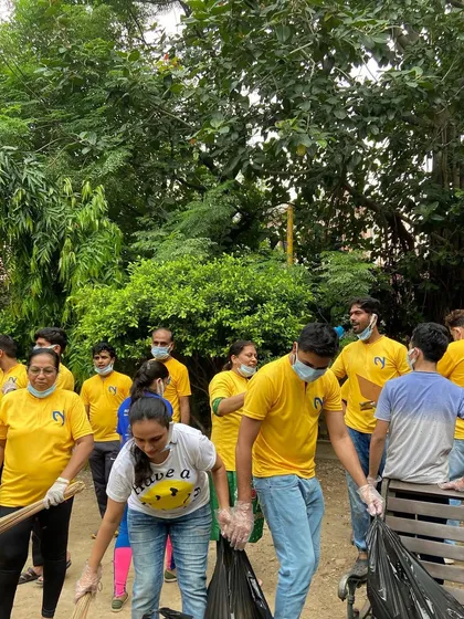 Our community members working together during a cleanliness drive, collecting trash and making our local park a better place for everyone.