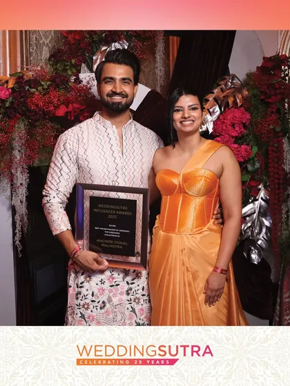 A stylish couple poses with their award at the WeddingSutra Influencer Awards. Our service is tailored for luxury events, ensuring a seamless and premium experience for all attendees.