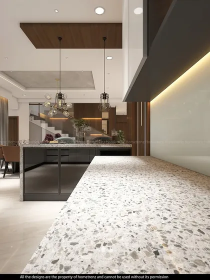This breakfast counter with a terrazzo-style top offers a perfect spot to start the day. It overlooks the dining and living areas, making it a central part of the home.