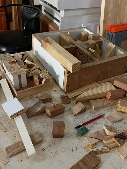 The "organized chaos" of a scrap wood project. It's amazing to see how these small, discarded offcuts can be combined to create something new and imaginative.