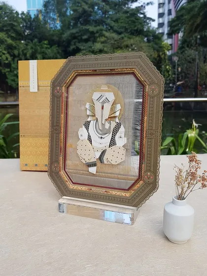 A unique wedding favor and invitation in one, featuring a Ganesha artwork in a beautiful frame. We love creative ideas that guests can cherish forever.