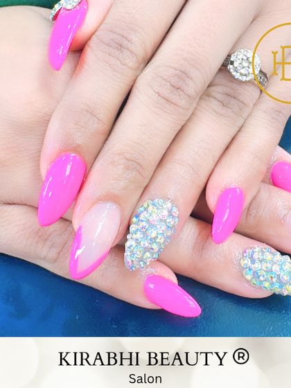 This set combines hot pink nails with accent nails completely covered in iridescent rhinestones. It's the ultimate glamorous and eye-catching manicure.