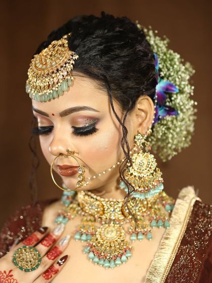 A close-up of a classic bridal eye makeup look. The combination of a soft brown smokey eye and winged liner is timeless and elegant.