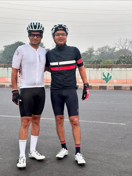 Two members in high-end Rapha and Le Col kits, posing for a photo.