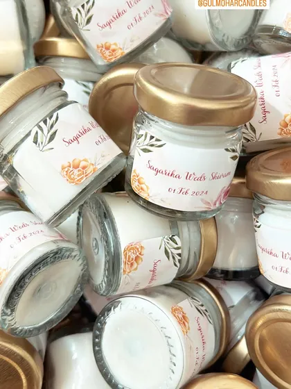 A pile of cute mini candles for Sagarika and Shivam's wedding. Custom labels make even the smallest gifts feel personal and special.