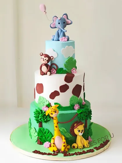 I brought the jungle to life with this three-tiered fondant cake for a child's birthday. It features handcrafted, edible animal figures like a lion, giraffe, monkey, and elephant, all set in a vibrant, leafy green landscape. Each tier tells a part of the story, making it an exciting centerpiece for any kids' party.