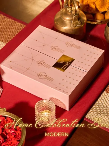 The Modern Home Celebration Box, designed with a contemporary aesthetic in soft pink. It’s filled with everything you need for a stylish and sparkling Diwali party.