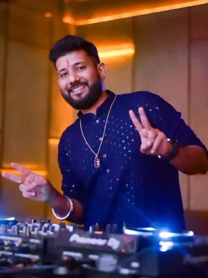 Peace and positivity from the DJ booth. Dressed in a traditional blue kurta for a festive vibe.