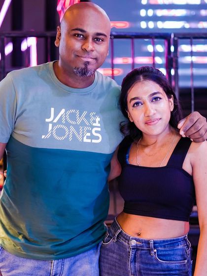 Posing with a guest.