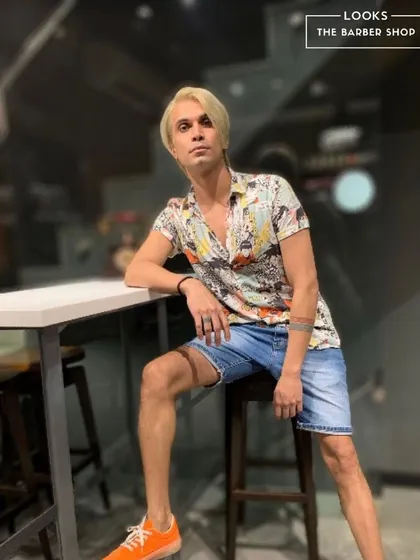 Another angle of the finished platinum blonde style. This full-coverage men's hair color is perfect for anyone looking to make a dramatic and fashionable change.