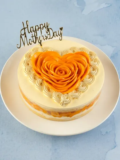 The Mom's Mango Tres Leches Cake, another heart-shaped special for Mother's Day. It's light, creamy, and full of fresh mango flavor.