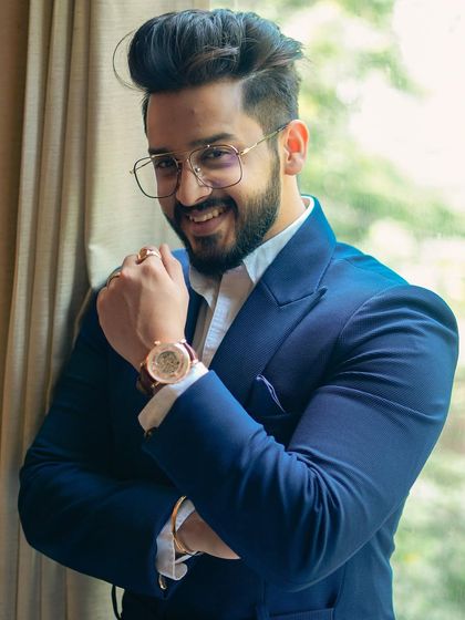 A happy and confident client in his custom blue suit. The perfect fit and modern design make for a winning combination.