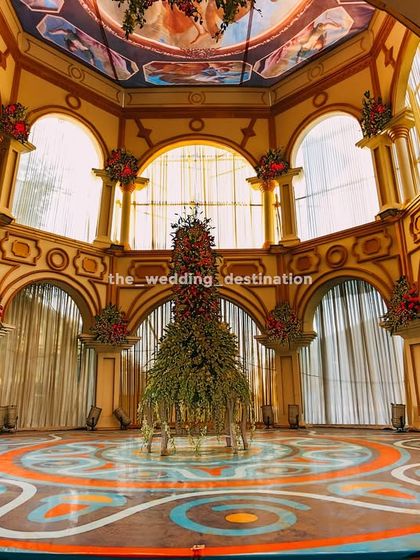 The full view of the grand hall with the painted dome ceiling and patterned floor. This type of decor completely transforms a space and transports guests to another world.