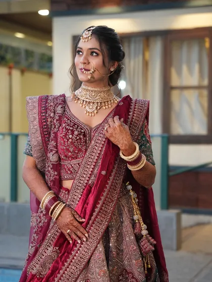 A close-up of a bride's reception makeup. The look features defined eyes, a flawless base, and a neutral lip, allowing her magnificent jewellery and outfit to shine.