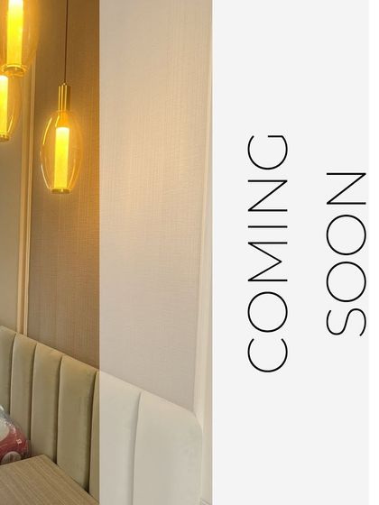 A sneak peek of our Palm Grove project, showing a close-up of the bed's headboard and elegant pendant lighting. This image hints at the minimalist and luxurious details of the soon-to-be-completed space.