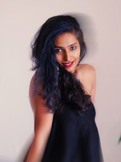 A beautiful portrait that combines a sharp, direct gaze with a hint of motion blur. It captures both stillness and fleeting energy in one frame.